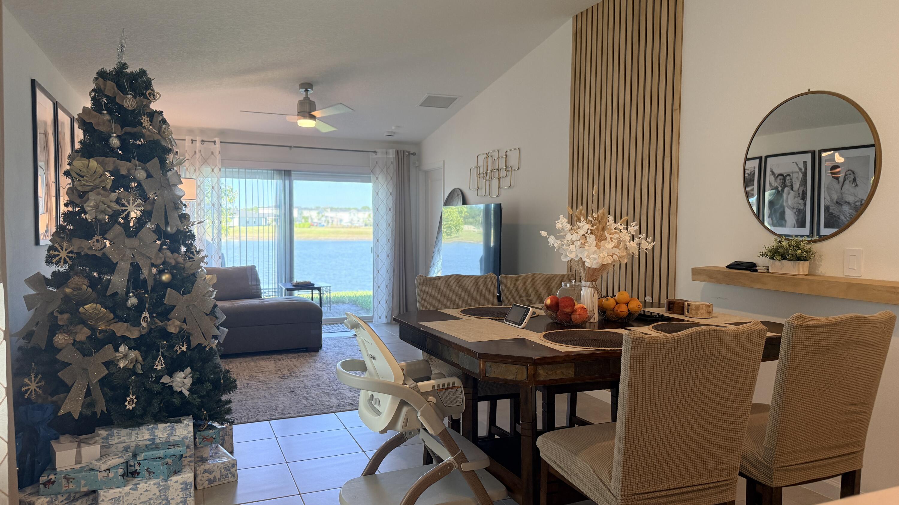 682 Papillon Street Southwest Palm Bay, FL 32908 - Photo 10 of 30 a dining room with furniture and window in a room