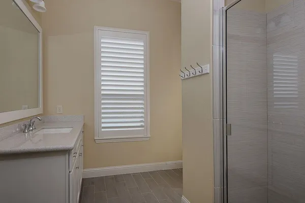 a bathroom with a sink and a mirror