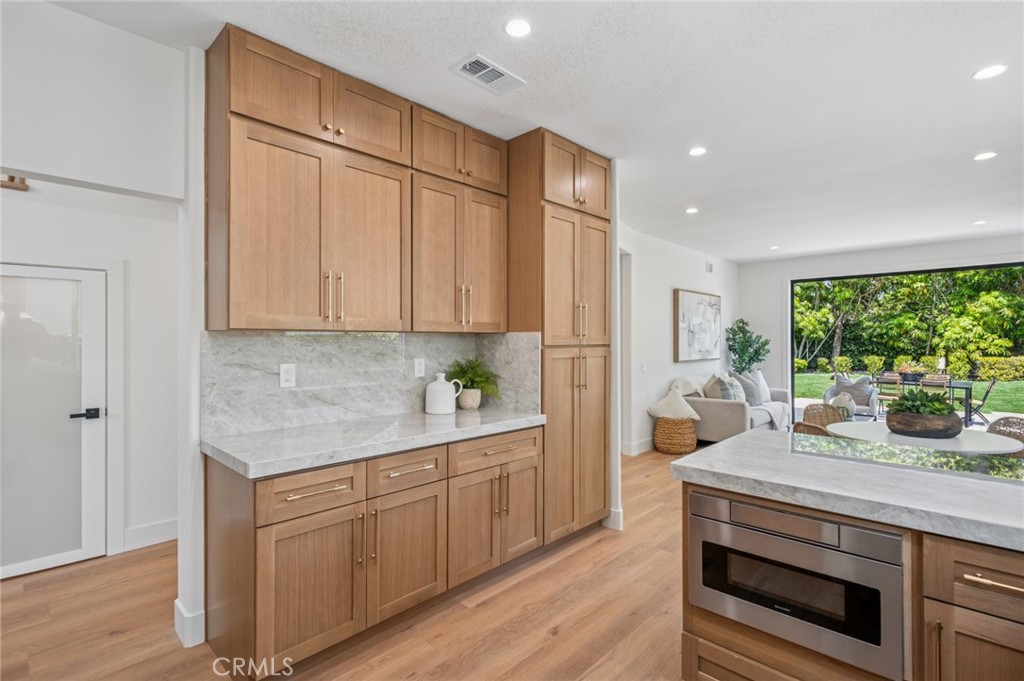 38 San Raphael Dana Point, CA 92629 - Photo 13 of 38 a kitchen with white cabinets and window