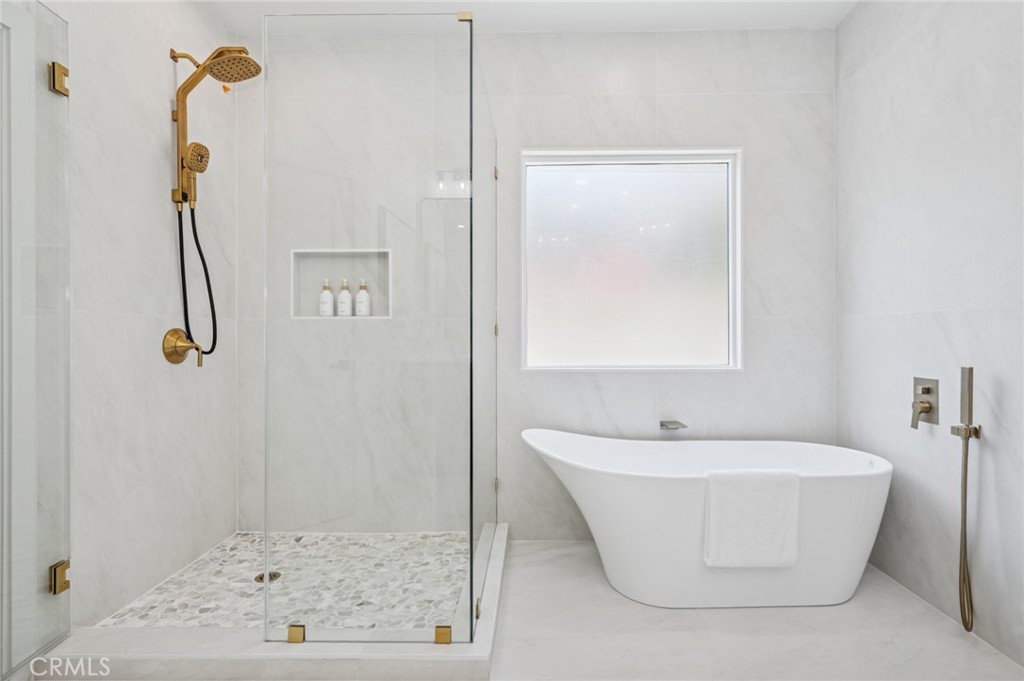 38 San Raphael Dana Point, CA 92629 - Photo 19 of 38 a white bath tub sitting next to a white sink