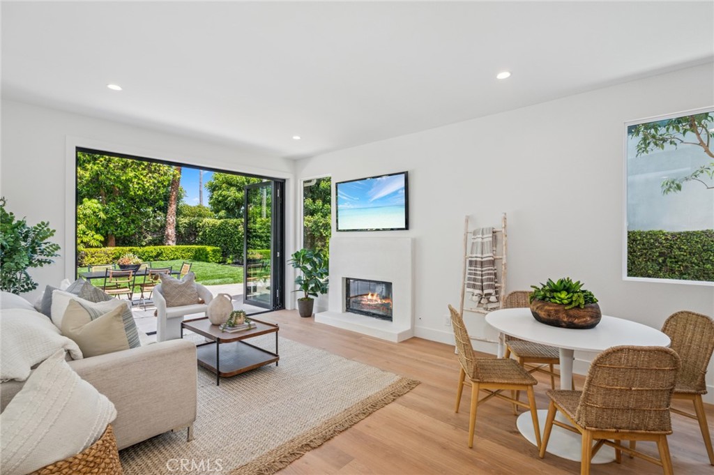 38 San Raphael Dana Point, CA 92629 - Photo 9 of 38 a living room with furniture fireplace and floor to ceiling windows