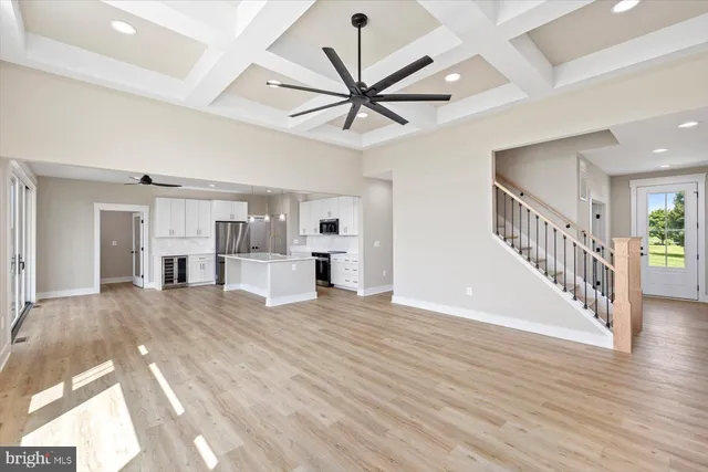 a spacious bathroom with a granite countertop sink mirror and a toilet