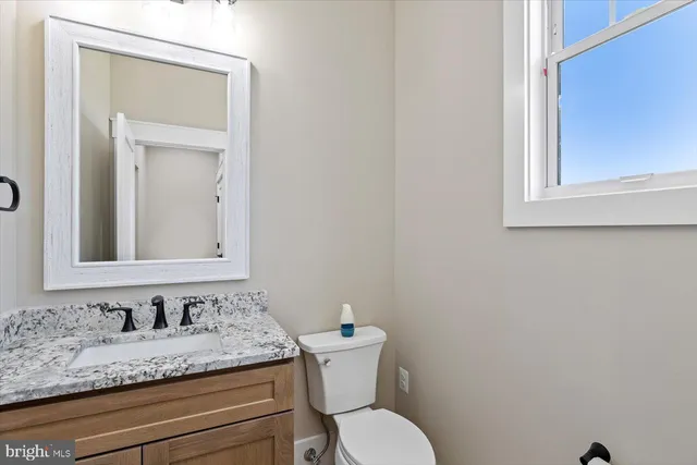 an aerial view of a house with a big yard