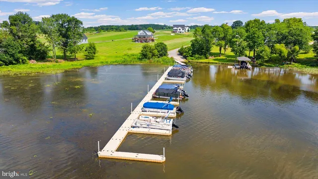 a view of a lake with houses in the back