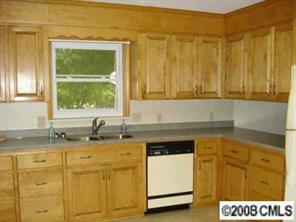 256 Frances Circle Fort Mill, SC 29708 - Photo 4 of 8 a kitchen with a sink a stove and cabinets