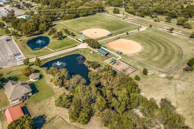 an aerial view of a house with a swimming pool