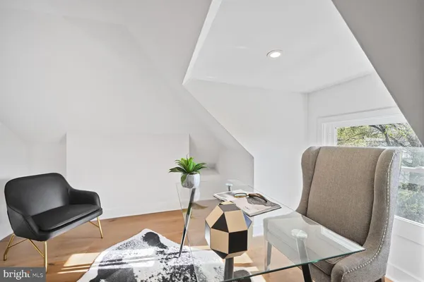 a room with furniture and a rug