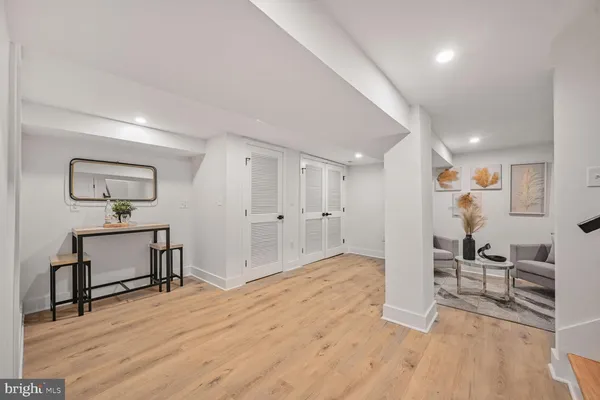 a bedroom with a bed a couch and dresser