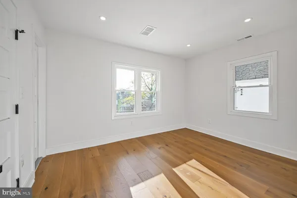 a bathroom with a granite countertop sink toilet tub and shower