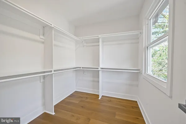 a bathroom with a granite countertop toilet sink and a bathtub