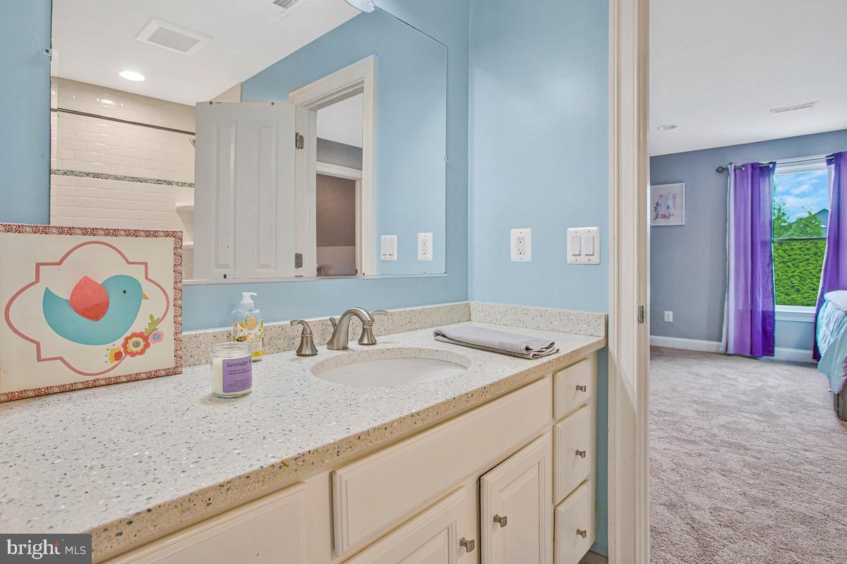 5 Jessie Road Harwood, MD 20776 - Photo 51 of 87 a bathroom with a granite countertop sink and a mirror