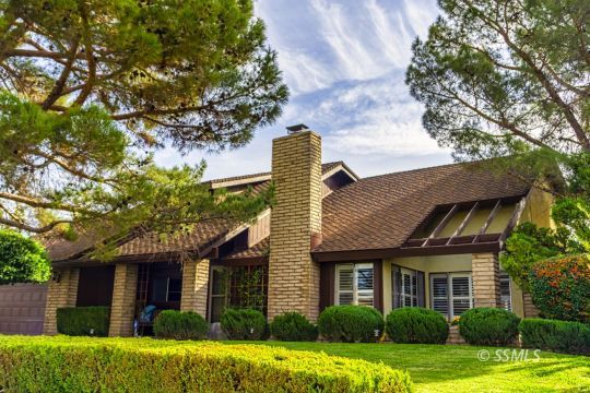 924 Scott Street Ridgecrest, CA 93555 - Photo 1 of 26 a front view of a house with a yard and garage