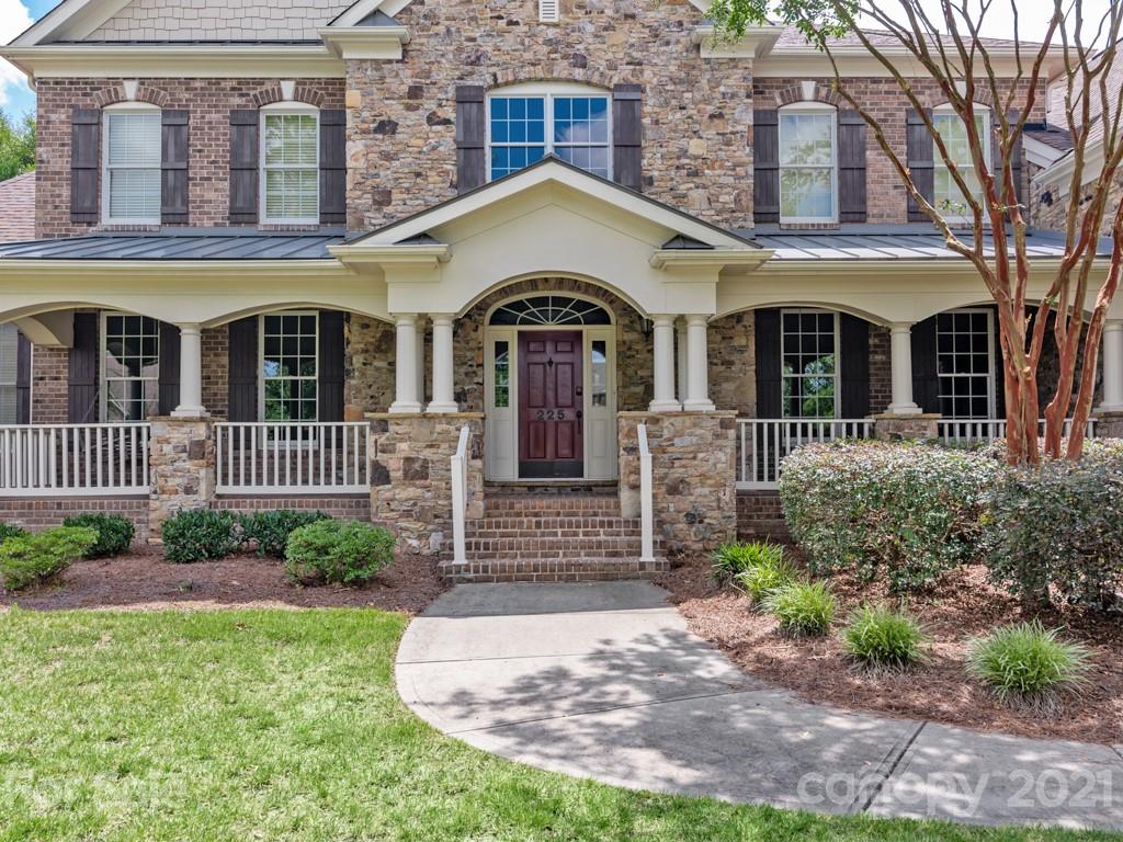 225 Cattle Ridge Road Marvin, NC 28173 - Photo 2 of 42 a front view of a house with garden