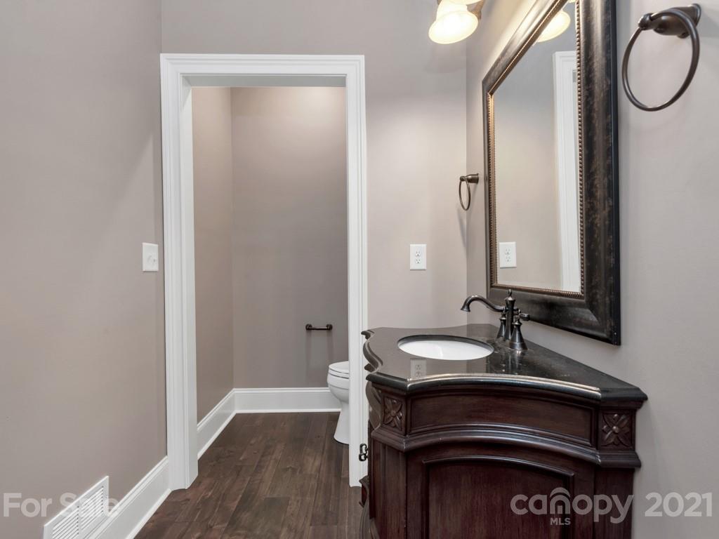 225 Cattle Ridge Road Marvin, NC 28173 - Photo 16 of 42 a bathroom with a sink and a mirror