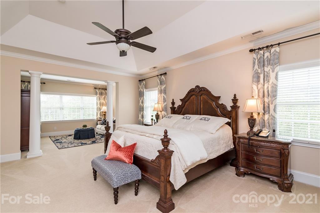 225 Cattle Ridge Road Marvin, NC 28173 - Photo 23 of 42 a spacious bedroom with a bed and window
