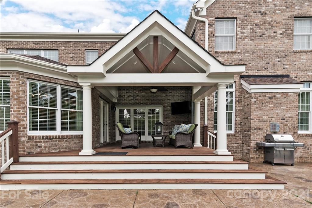 225 Cattle Ridge Road Marvin, NC 28173 - Photo 35 of 42 a view of a house with a floor to ceiling windows and a rug
