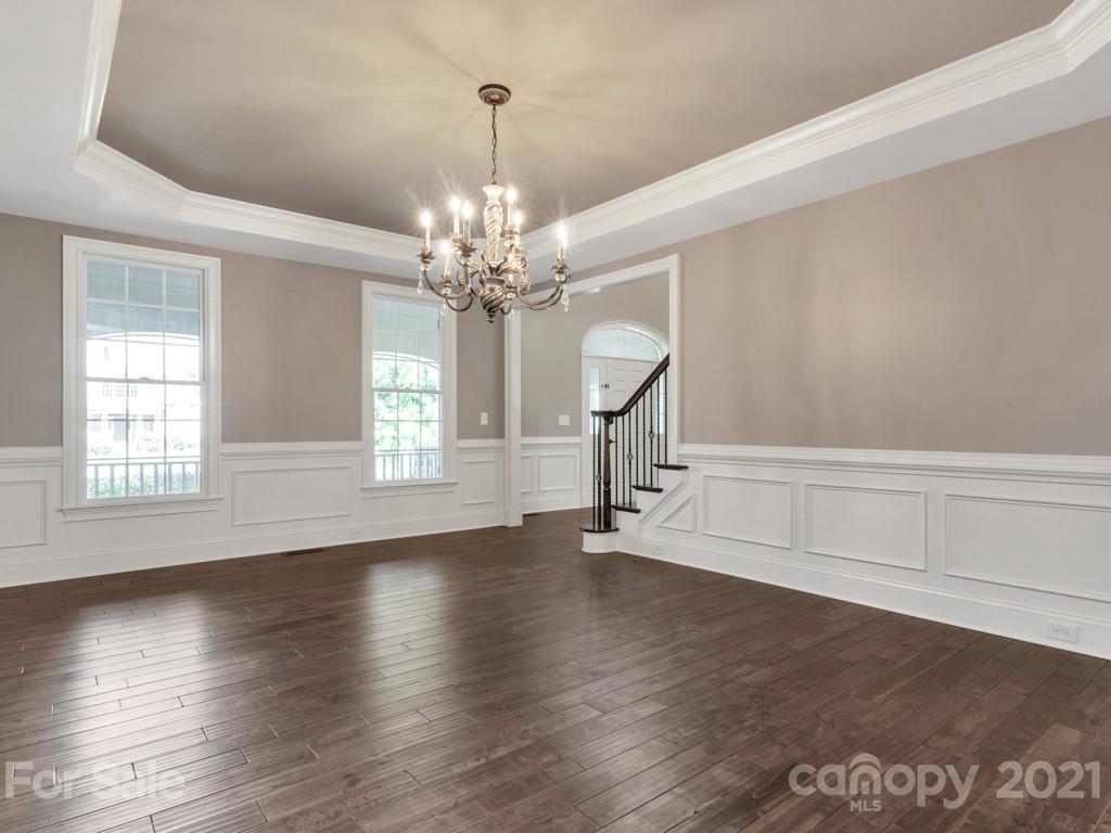 225 Cattle Ridge Road Marvin, NC 28173 - Photo 7 of 42 a view of an empty room with wooden floor barbeque and a window
