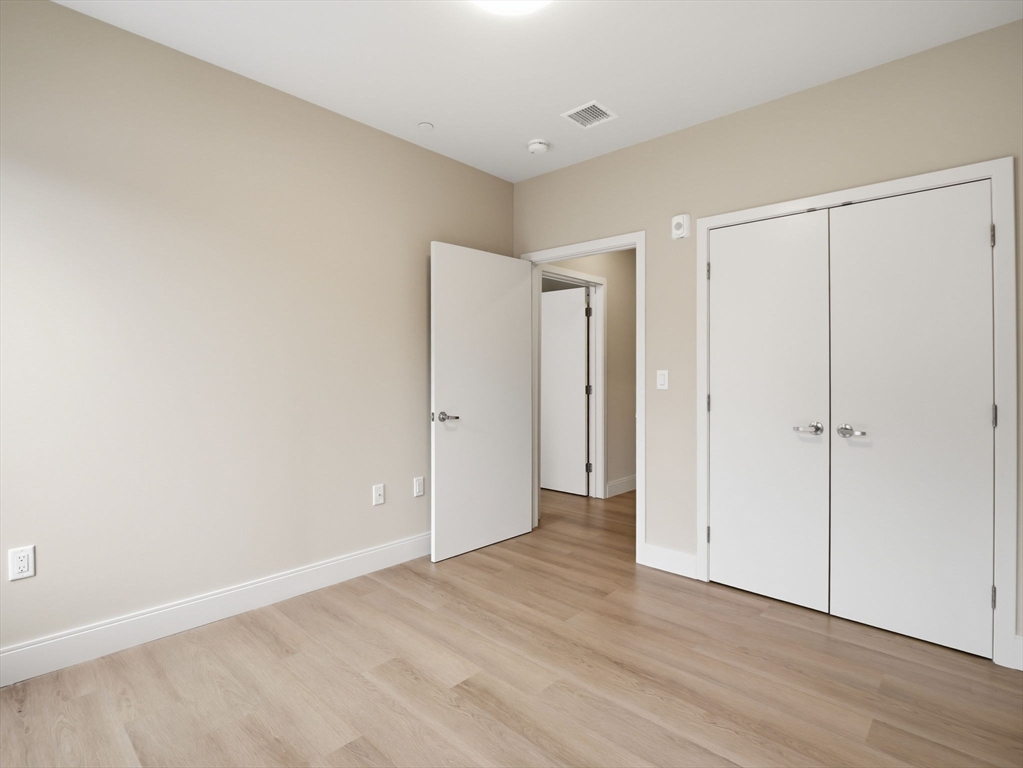 249 Corey Road, Unit 105 Boston, MA 02135 - Photo 16 of 41 a view of an empty room