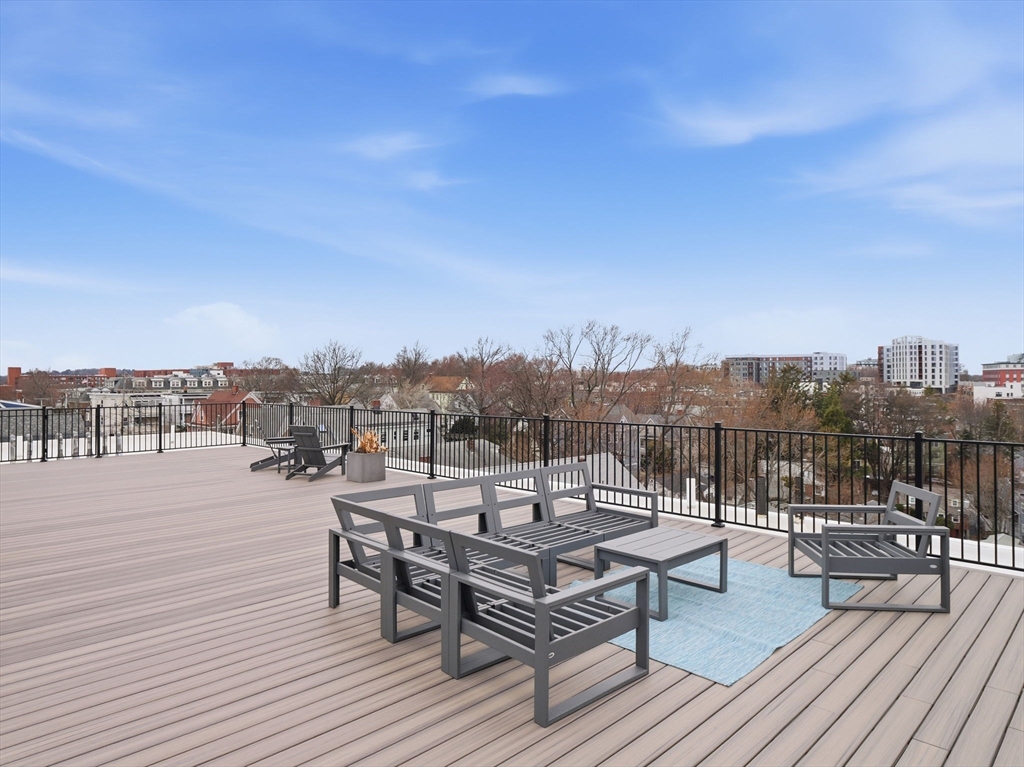 249 Corey Road, Unit 105 Boston, MA 02135 - Photo 25 of 41 a view of a terrace with chairs