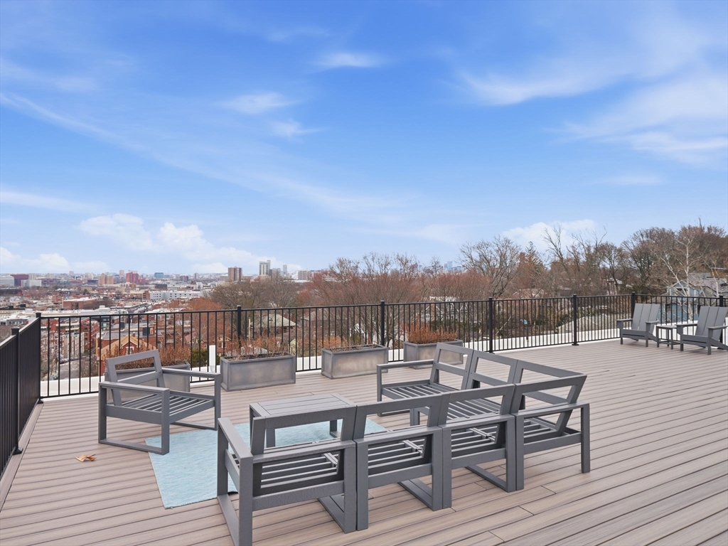 249 Corey Road, Unit 105 Boston, MA 02135 - Photo 27 of 41 a view of a terrace with seating area