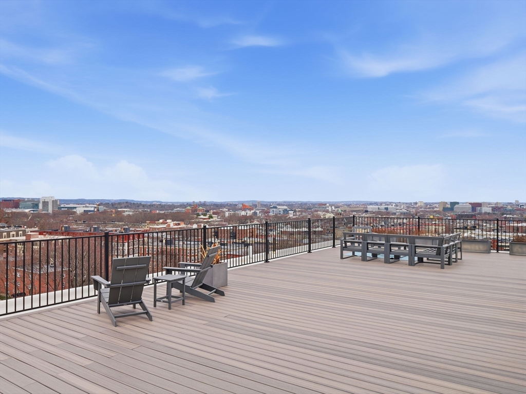 249 Corey Road, Unit 105 Boston, MA 02135 - Photo 28 of 41 a view of a terrace with sitting area