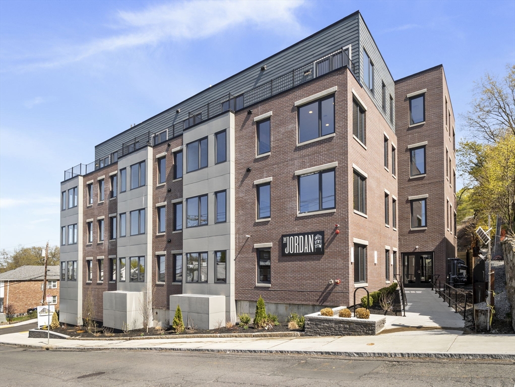 249 Corey Road, Unit 105 Boston, MA 02135 - Photo 34 of 41 a front view of a building with street