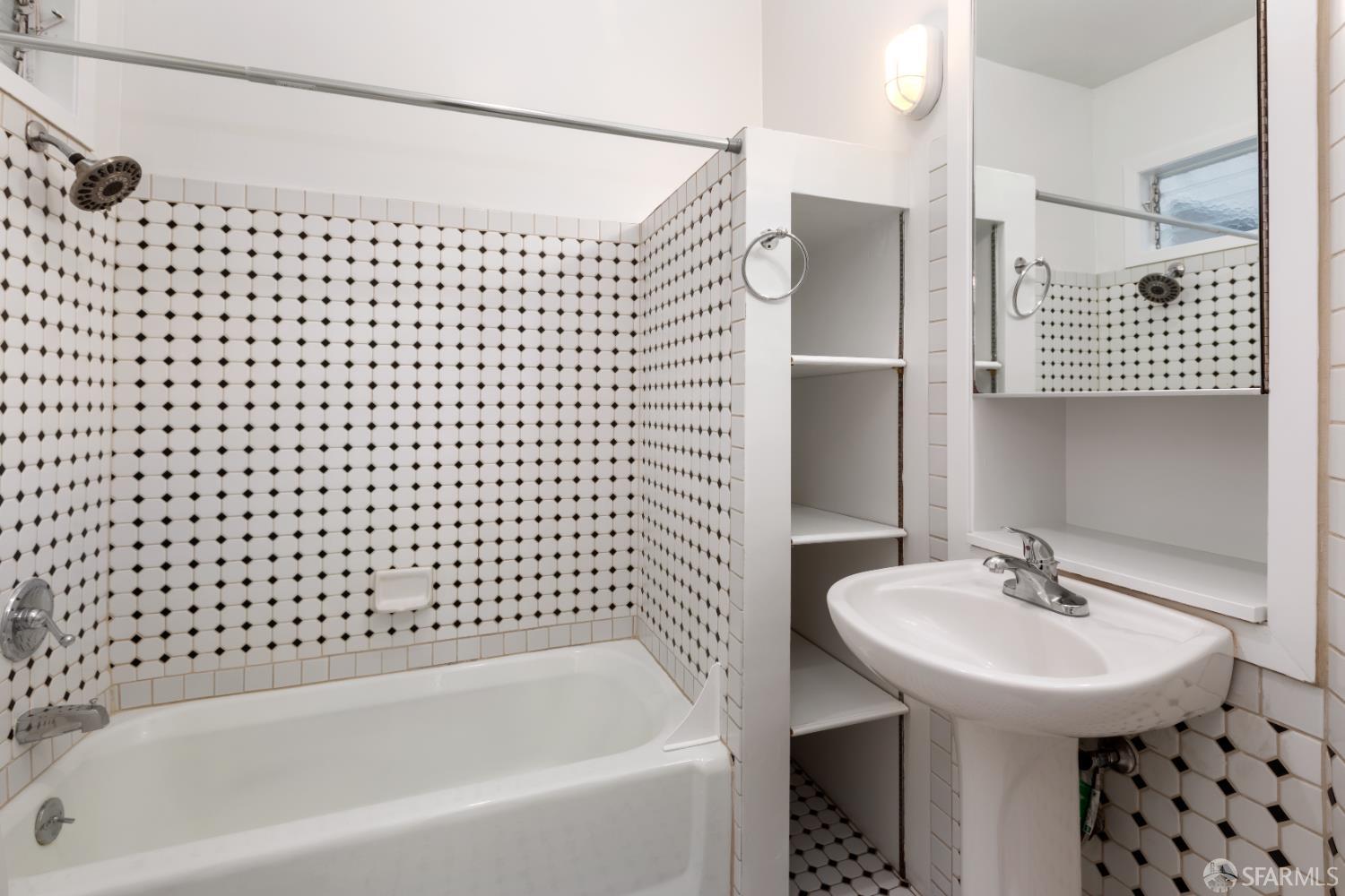 1338 Larkin Street San Francisco, CA 94109 - Photo 12 of 56 a bathroom with a sink and a bathtub