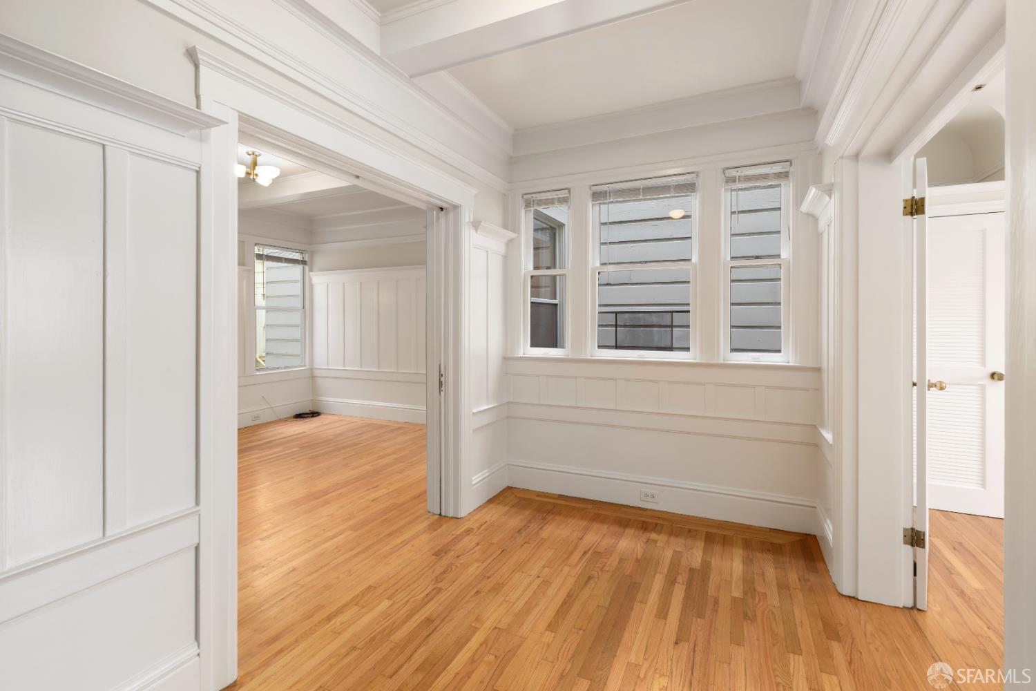 1338 Larkin Street San Francisco, CA 94109 - Photo 20 of 56 wooden floor in an empty room with a window