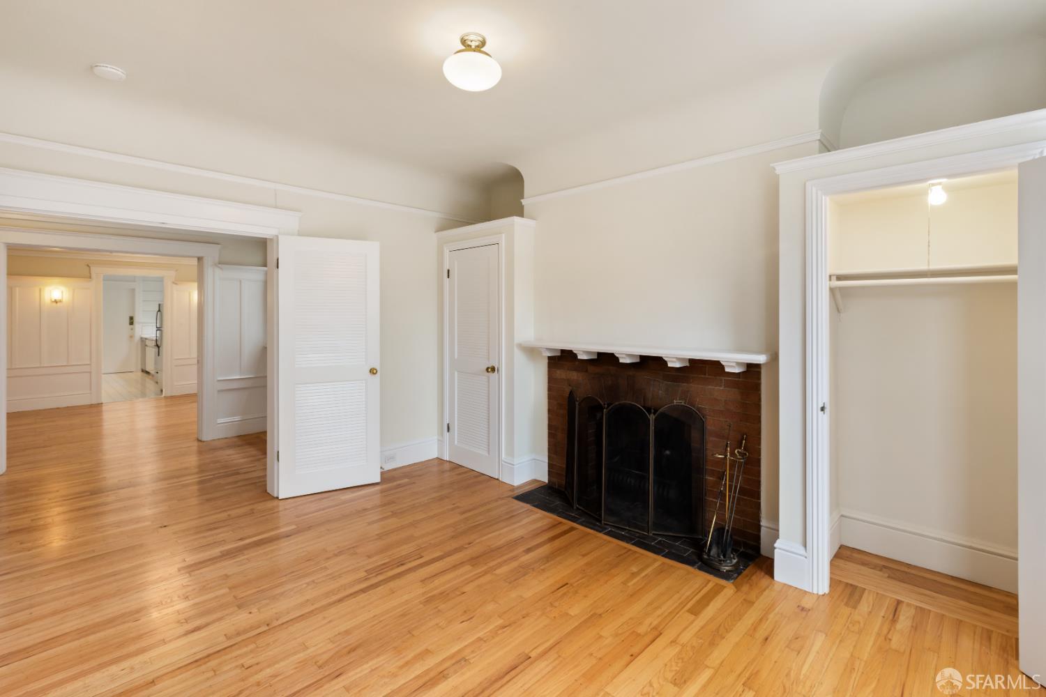 1338 Larkin Street San Francisco, CA 94109 - Photo 24 of 56 a view of a livingroom with wooden floor and a fireplace