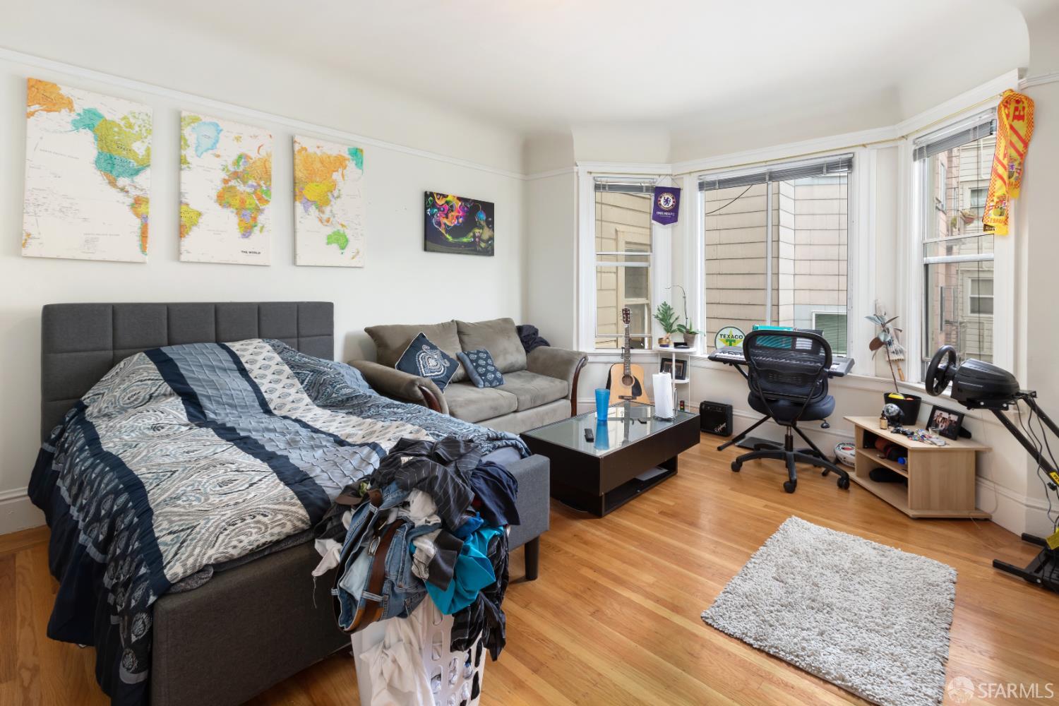 1338 Larkin Street San Francisco, CA 94109 - Photo 40 of 56 a bed room with a bed and a couch