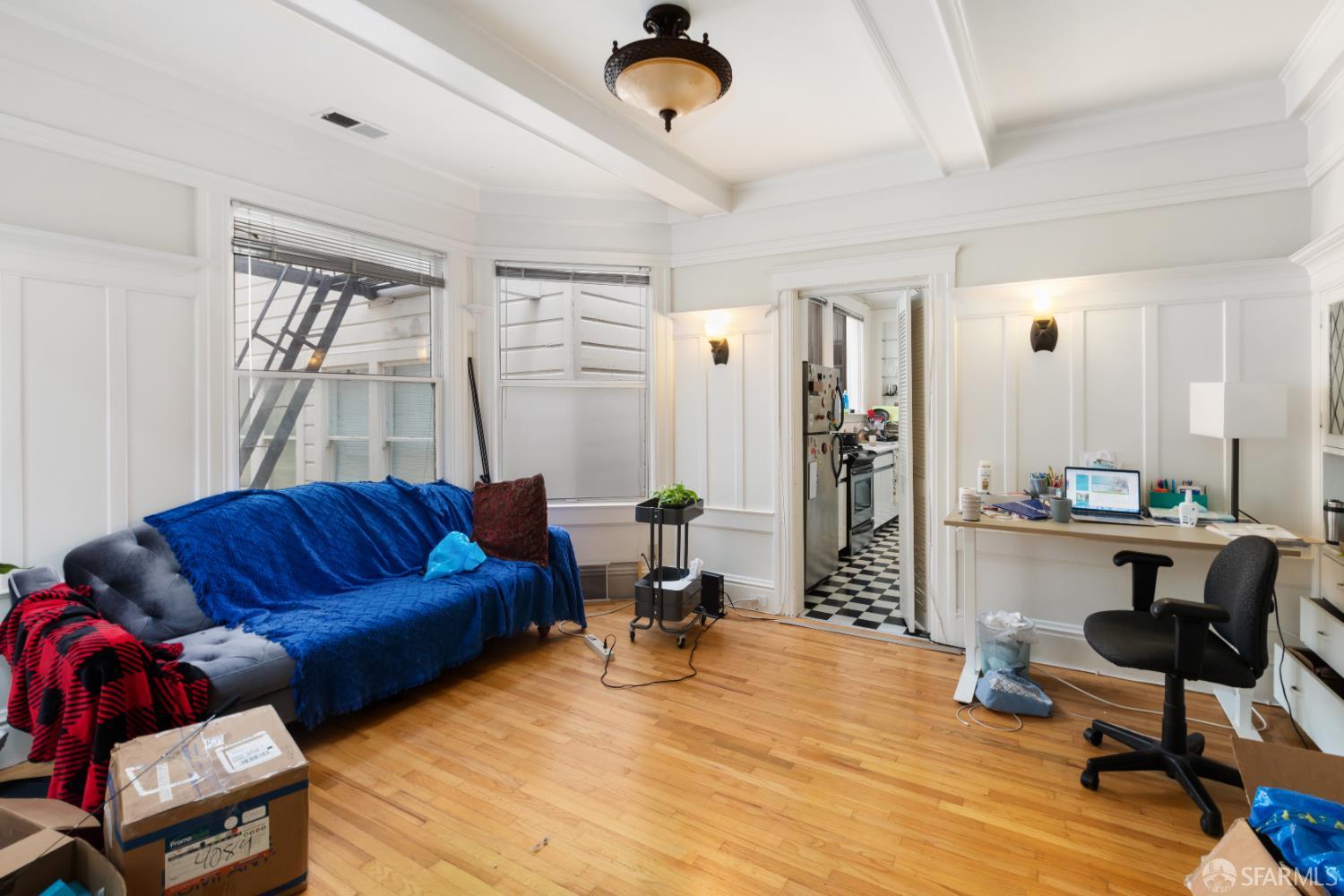 1338 Larkin Street San Francisco, CA 94109 - Photo 45 of 56 a living room with furniture a window and a chandelier