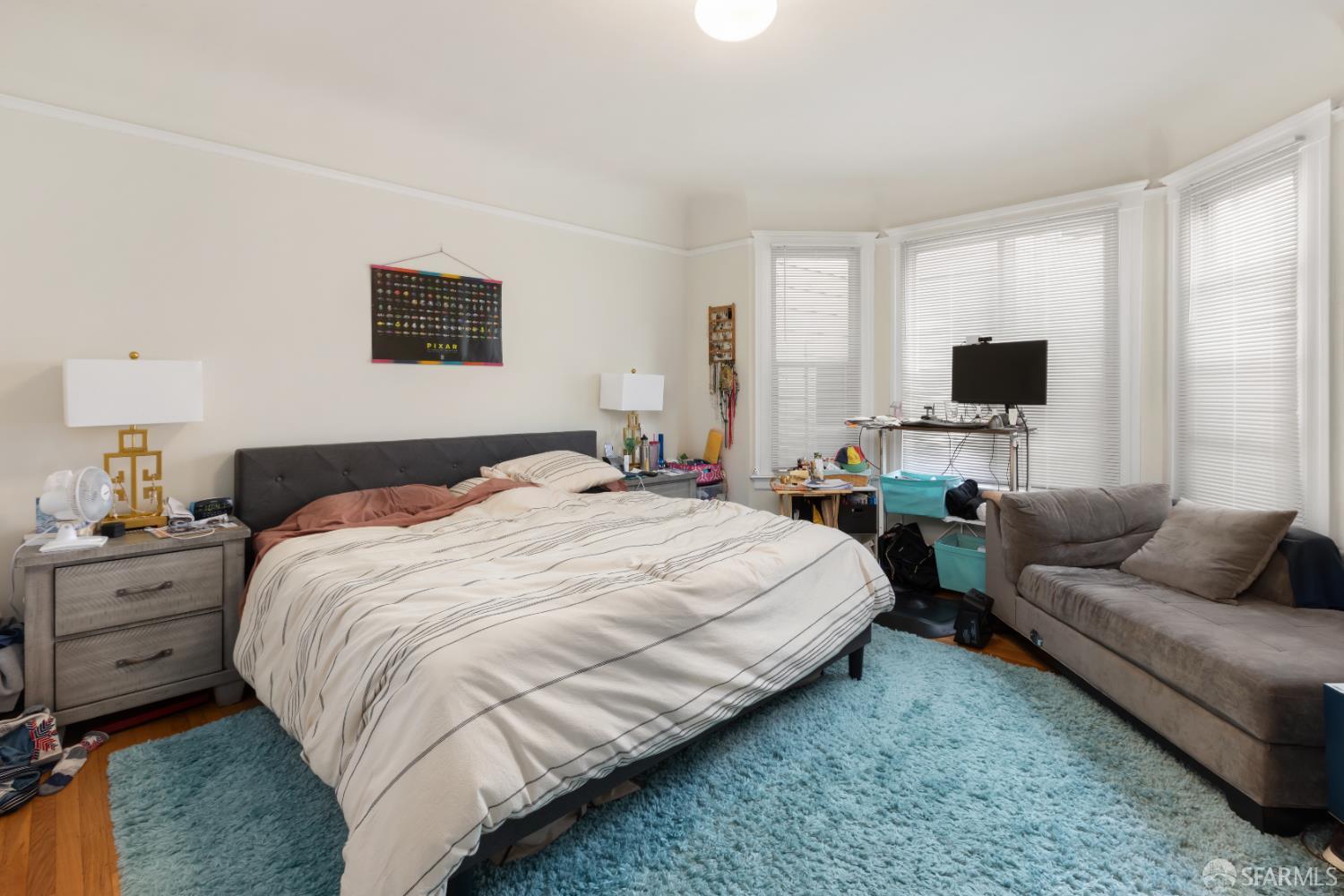 1338 Larkin Street San Francisco, CA 94109 - Photo 48 of 56 a bedroom with a bed and a couch