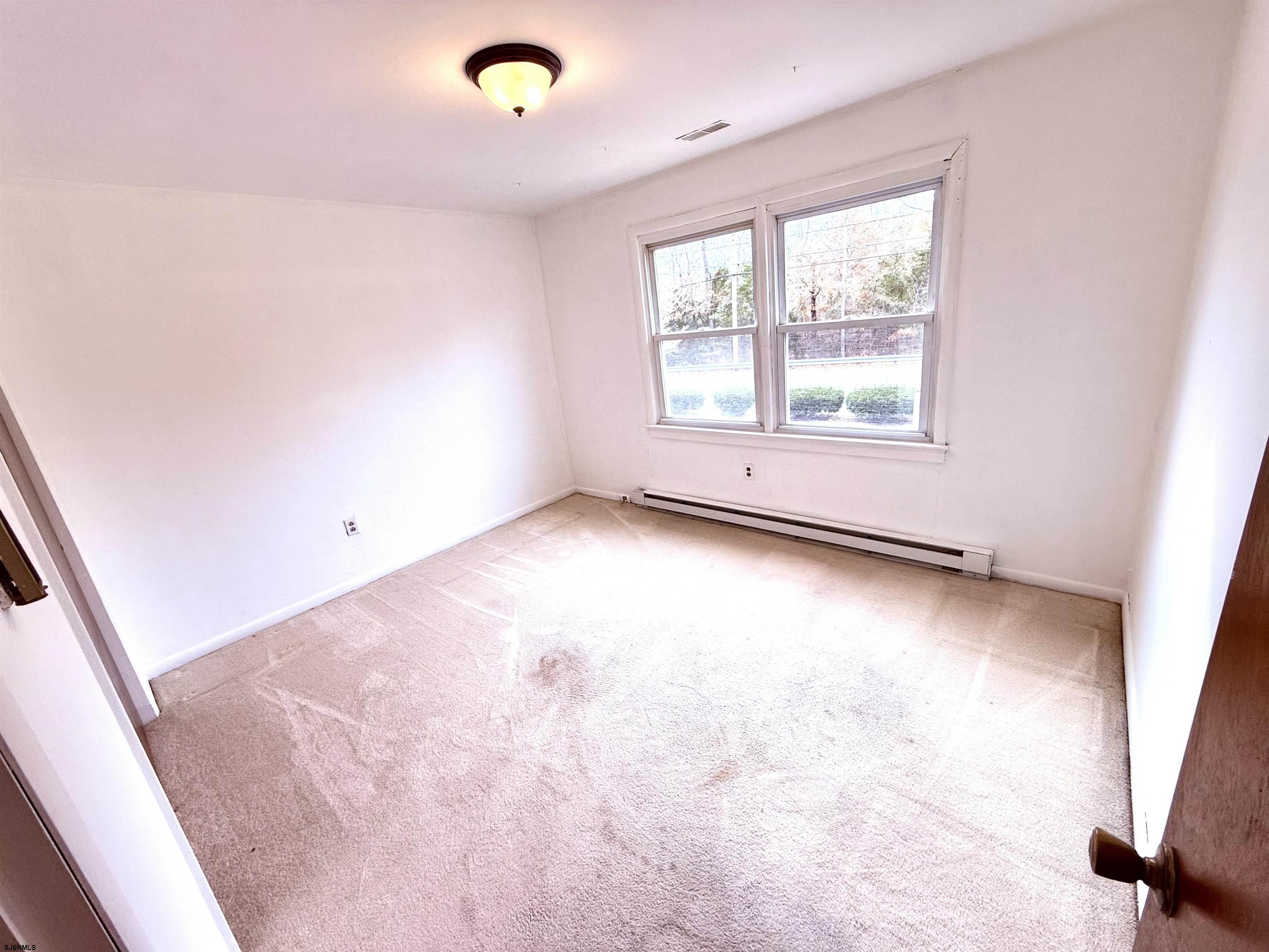 241 Mill Road Woodbine, NJ 08270 - Photo 18 of 31 an empty room with windows