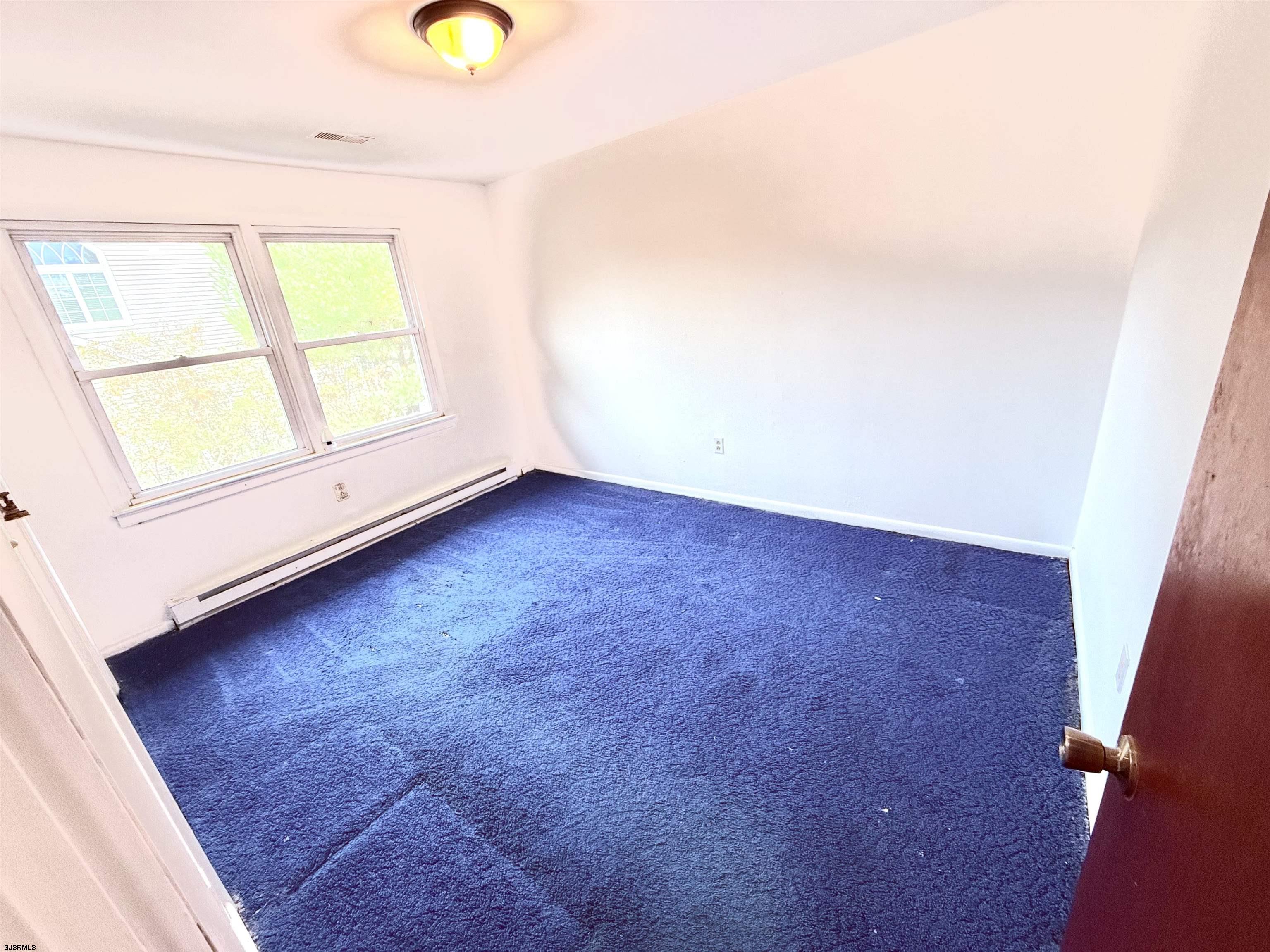 241 Mill Road Woodbine, NJ 08270 - Photo 22 of 31 a view of an empty room with a window