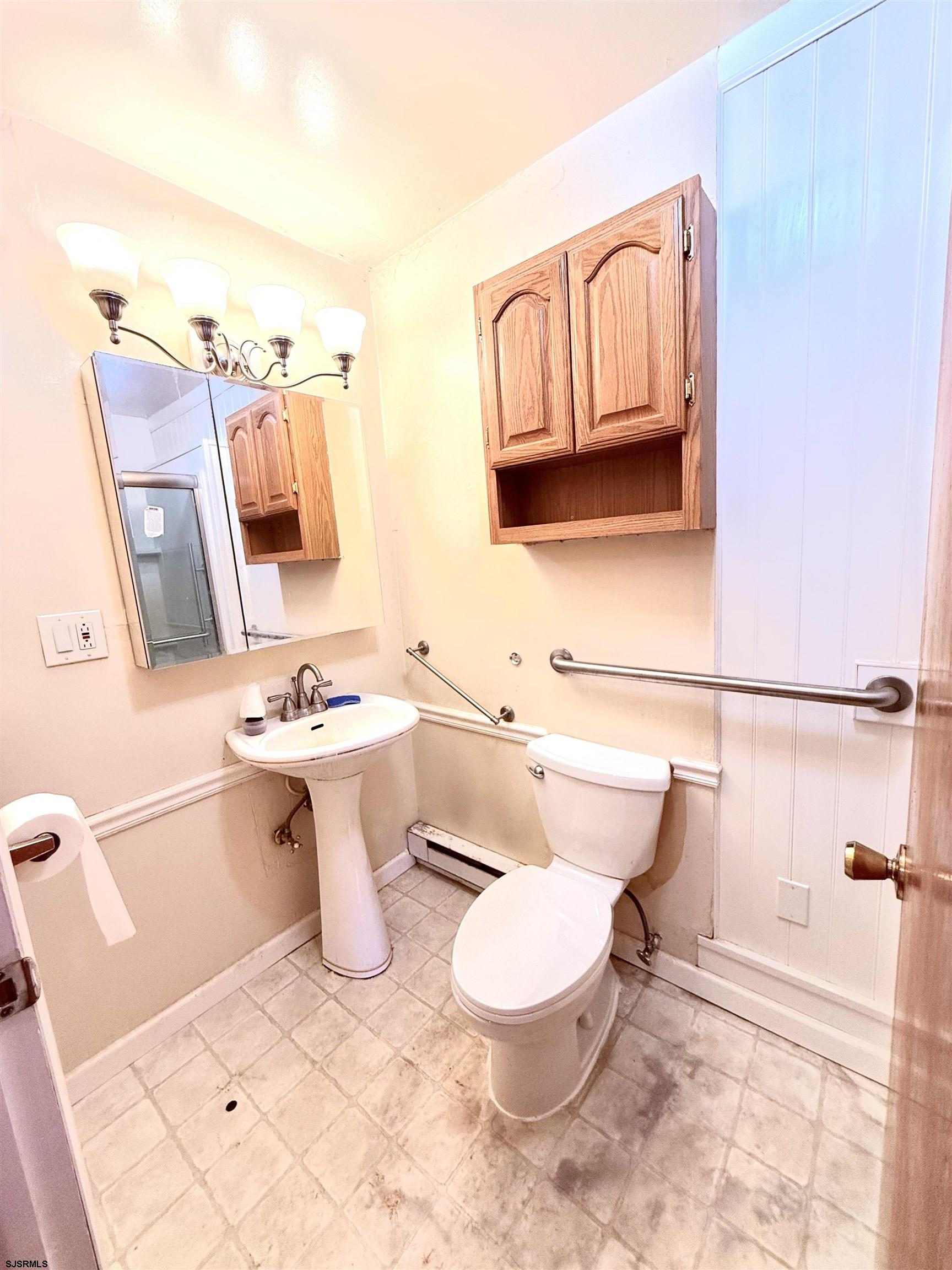 241 Mill Road Woodbine, NJ 08270 - Photo 27 of 31 a bathroom with a sink toilet and mirror