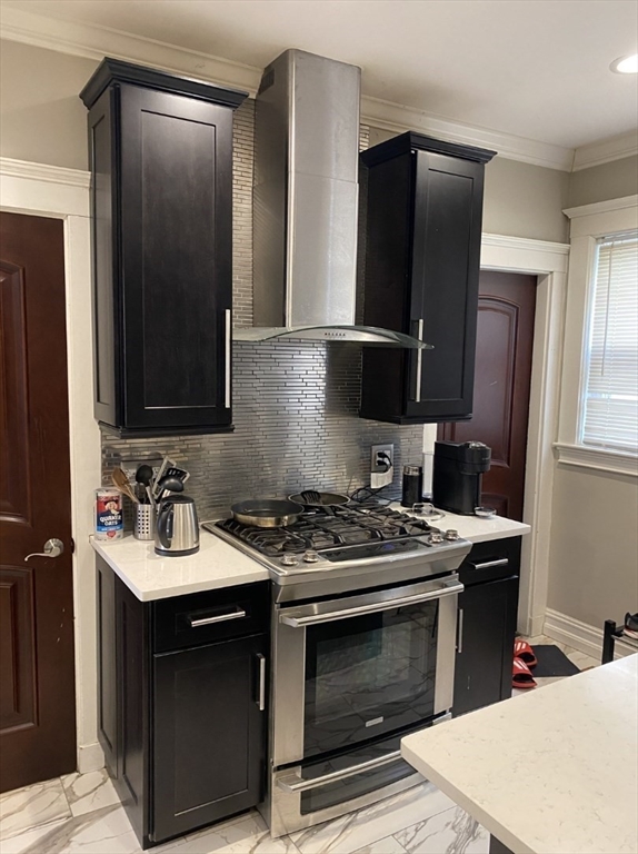 19 Pleasant Street, Unit 1 Boston, MA 02125 - Photo 3 of 10 a kitchen with a stove and a refrigerator
