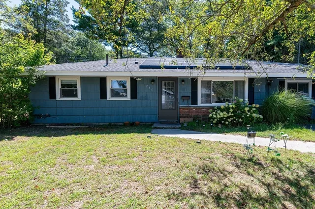 a front view of a house with a yard