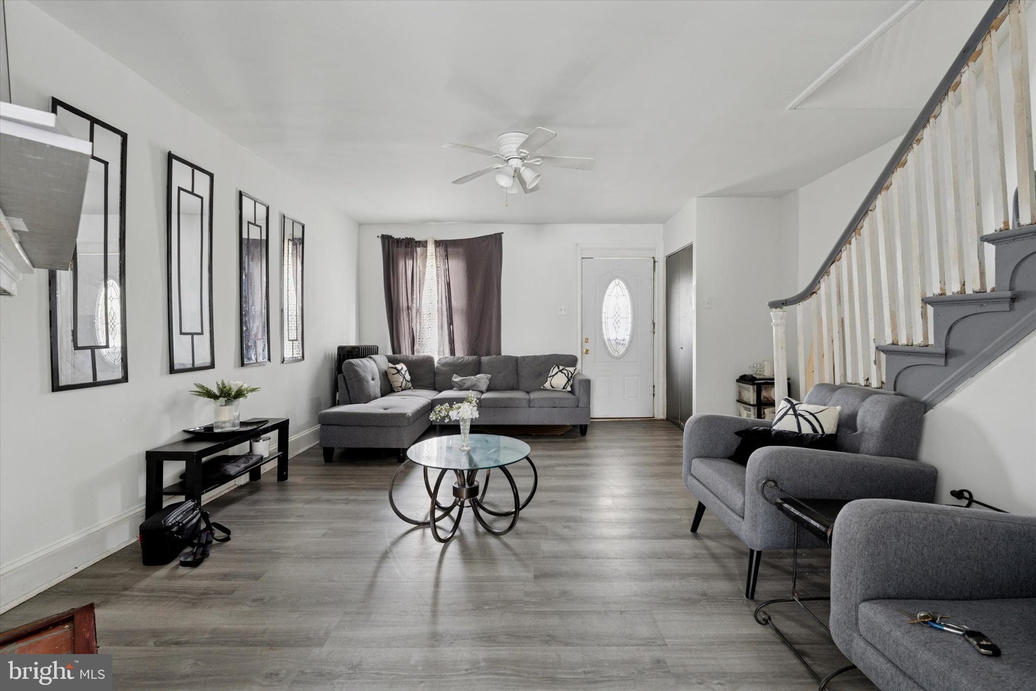 219 Laurel Road Sharon Hill, PA 19079 - Photo 1 of 15 a living room with furniture and a wooden floor