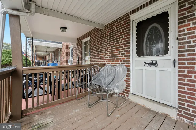 a view of a chair and table in the balcony