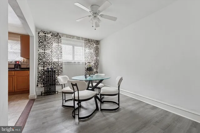 a view of a dining room with furniture and window