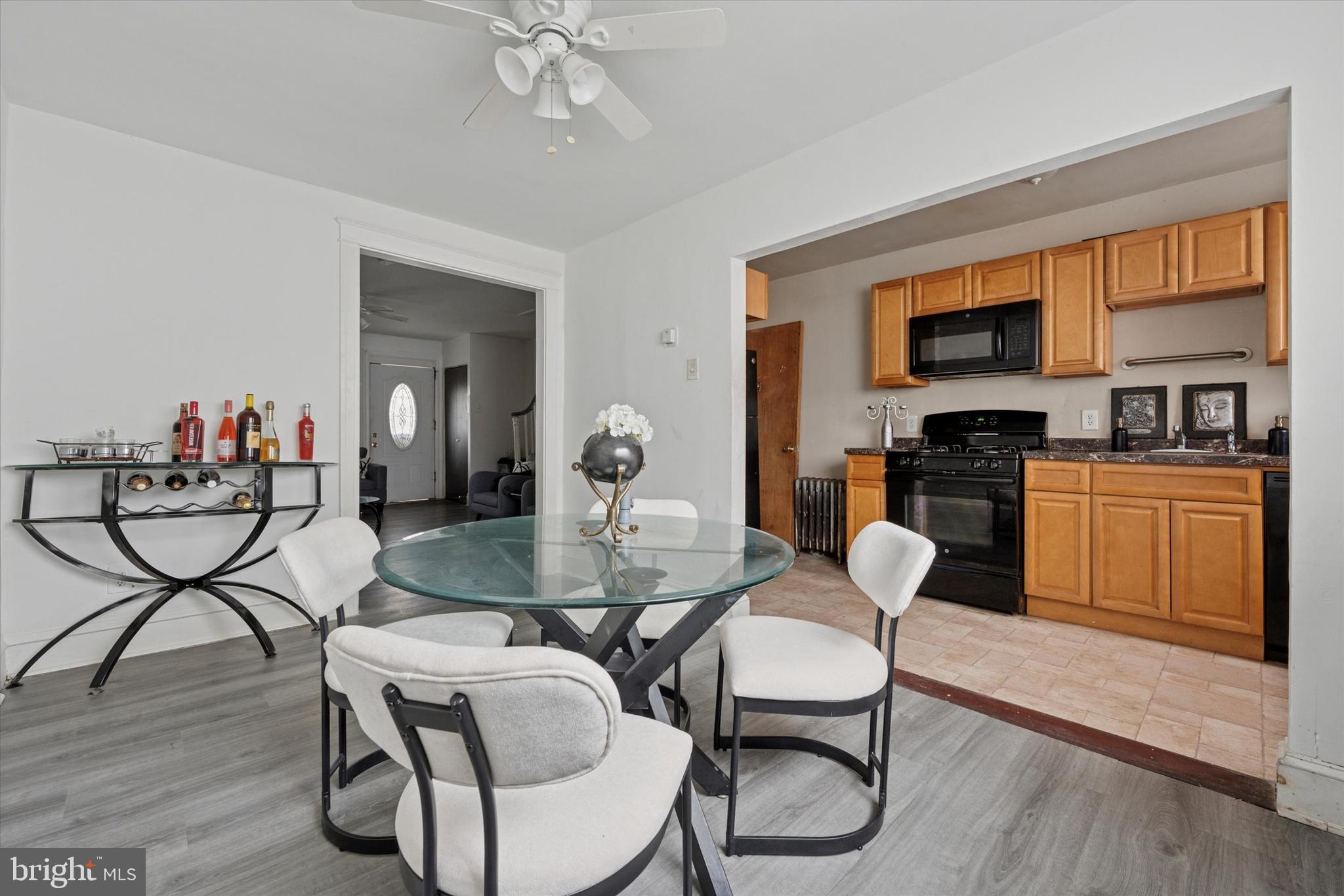 219 Laurel Road Sharon Hill, PA 19079 - Photo 5 of 15 a view of a dining room with furniture and wooden floor