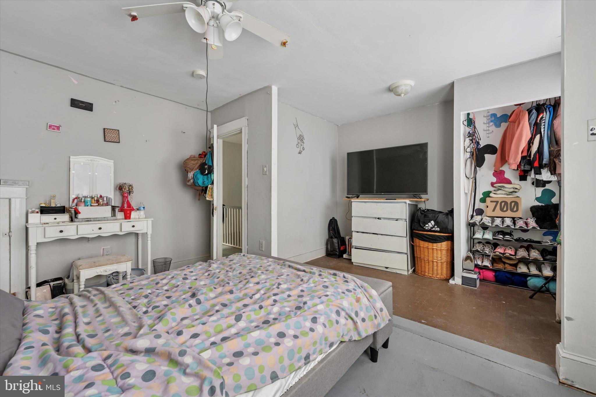 219 Laurel Road Sharon Hill, PA 19079 - Photo 8 of 15 a bedroom with a bed and a flat tv screen on dresser
