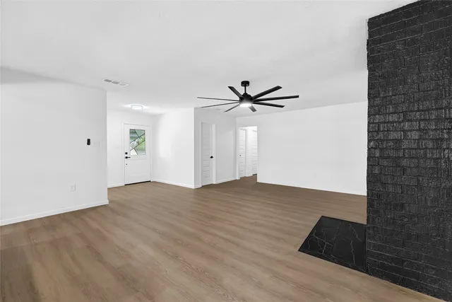 a view of a livingroom with wooden floor