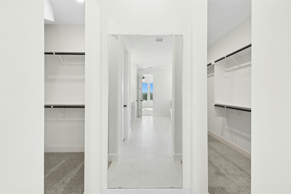 1533 Rodeo Ridge Drive Georgetown, TX 78628 - Photo 16 of 34 Spacious closet with light carpet and light tile patterned floors