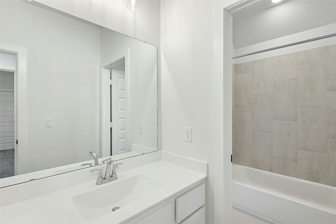 1533 Rodeo Ridge Drive Georgetown, TX 78628 - Photo 25 of 34 Full bathroom featuring vanity and shower / bathtub combination