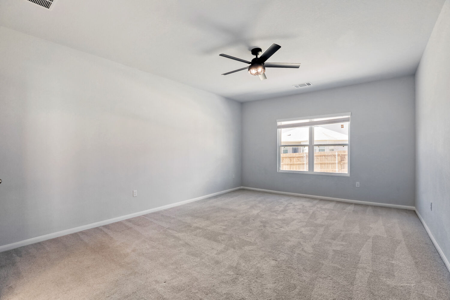 6601 Avila Way Pflugerville, TX 78660 - Photo 11 of 28 Unfurnished room with ceiling fan and light colored carpet