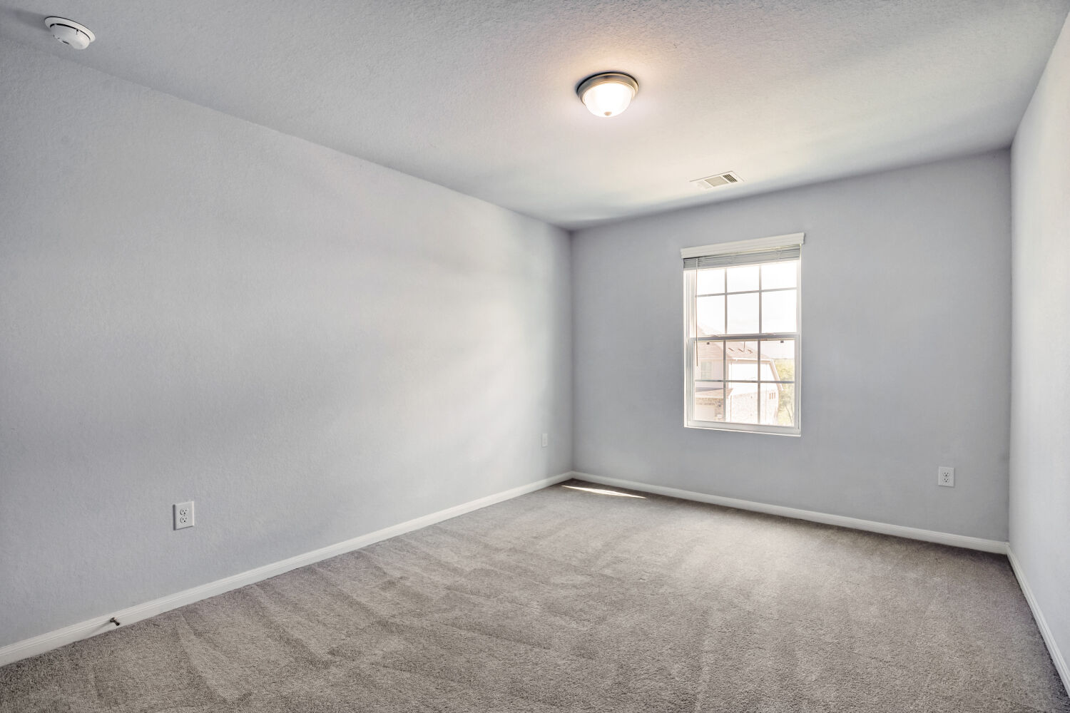 6601 Avila Way Pflugerville, TX 78660 - Photo 12 of 28 Carpeted empty room with baseboards and a textured ceiling