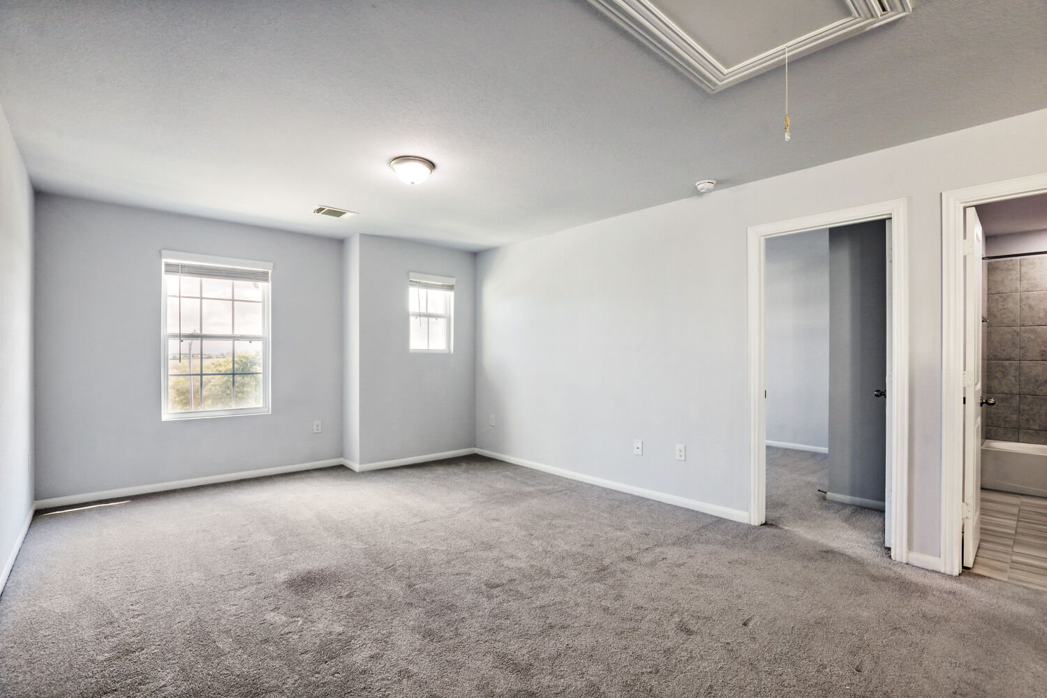 6601 Avila Way Pflugerville, TX 78660 - Photo 13 of 28 Unfurnished bedroom with carpet and connected bathroom