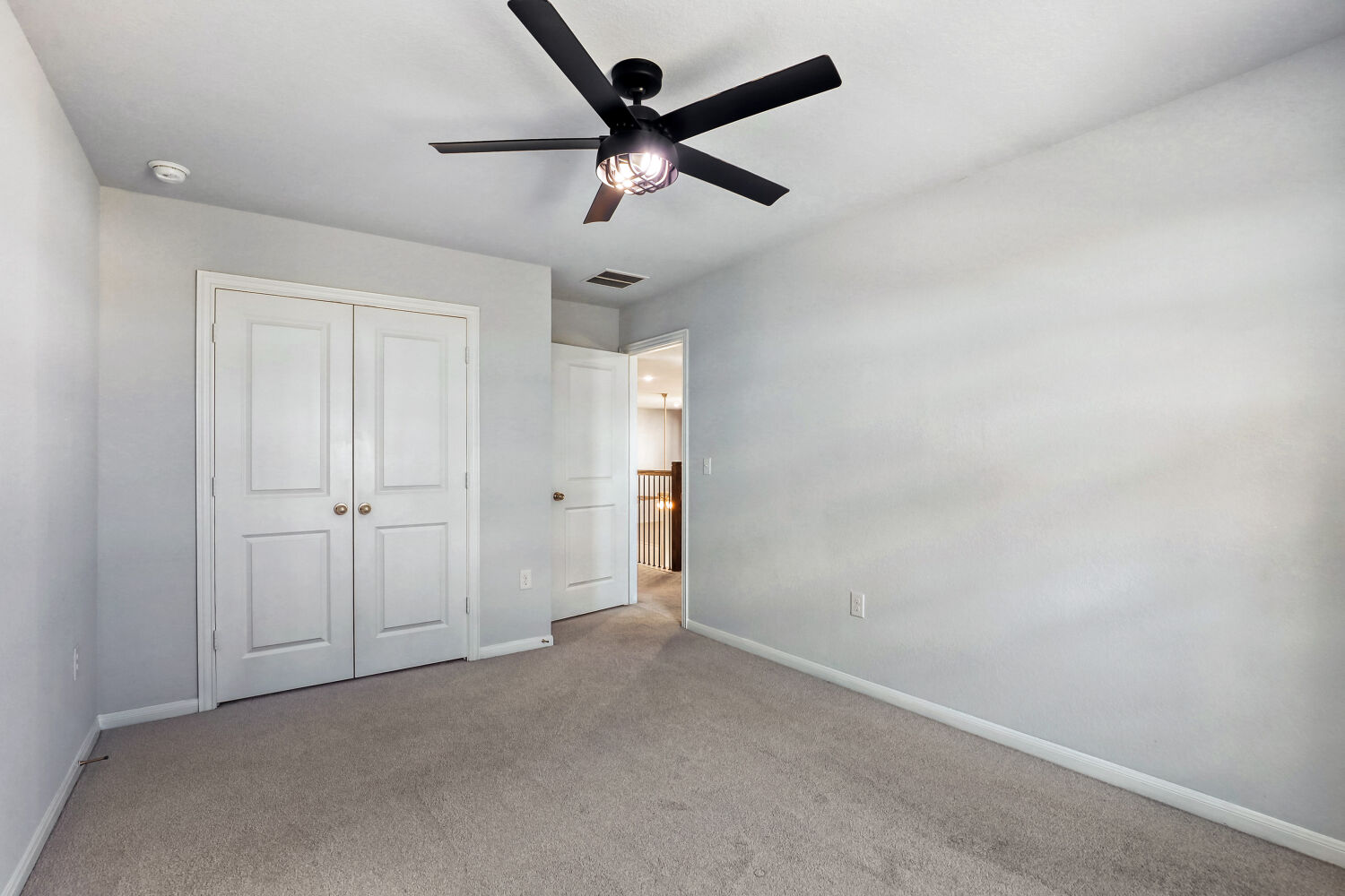 6601 Avila Way Pflugerville, TX 78660 - Photo 15 of 28 Unfurnished bedroom with a ceiling fan, carpet floors, and a closet