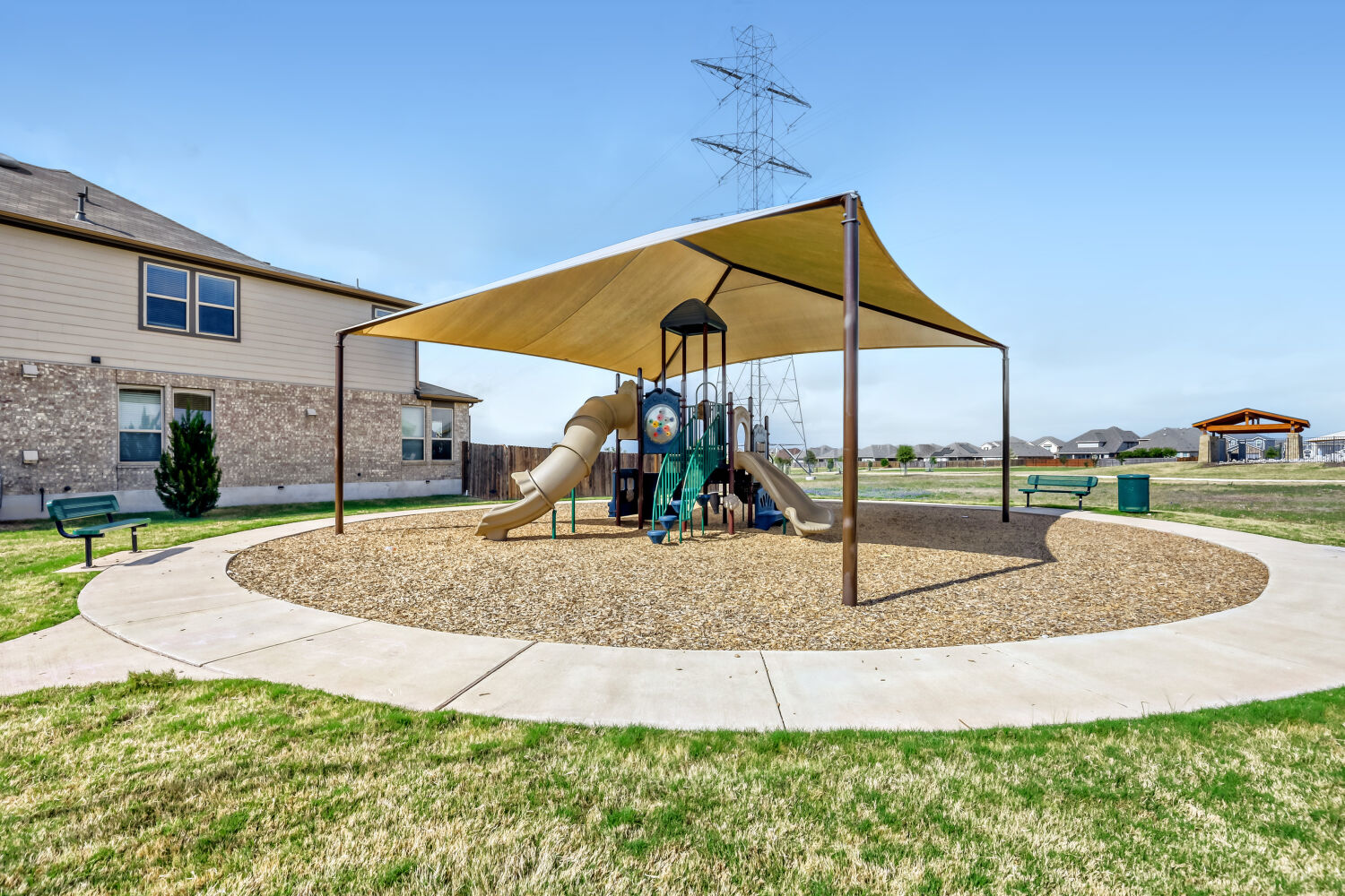 6601 Avila Way Pflugerville, TX 78660 - Photo 28 of 28 Communal playground featuring a lawn